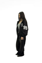 “RECOIL” VARSITY ZIP UP - BLACK